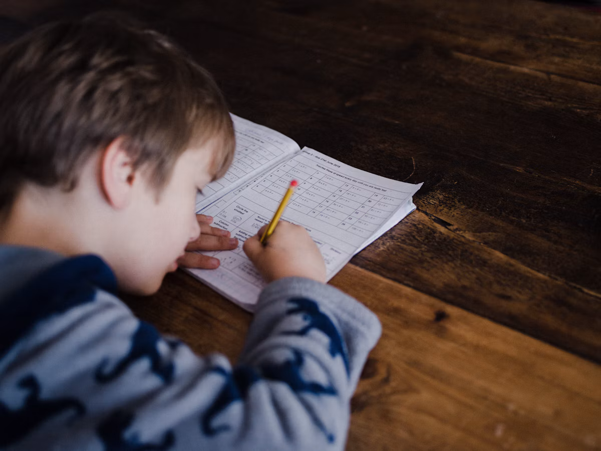 A child absorbed in focused, hands-on work