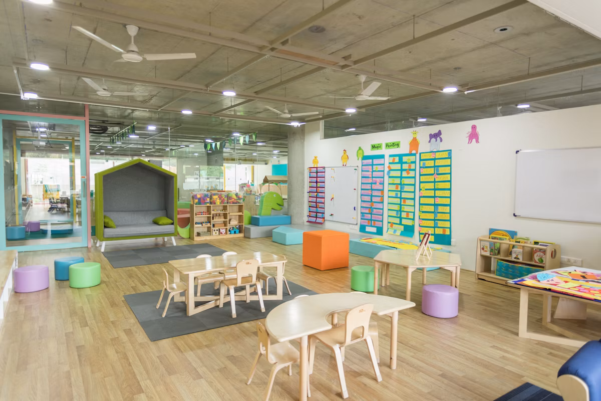 A bright, prepared Montessori classroom with child-sized furniture